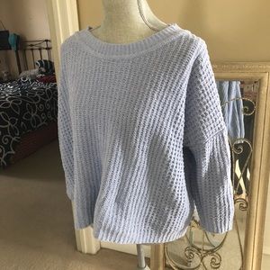 A cozy baby blue sweater size large